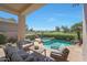 Beautiful covered patio with a pool, hot tub, golf course view, and comfortable seating at 7705 E Doubletree Ranch Rd # 8, Scottsdale, AZ 85258