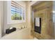 Neutral bathroom with a glass shower, window with shutters, and decorative accents at 7705 E Doubletree Ranch Rd # 8, Scottsdale, AZ 85258