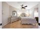 Charming bedroom with gray and tan furniture, complemented by wood flooring and natural light at 7705 E Doubletree Ranch Rd # 8, Scottsdale, AZ 85258