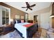 Inviting bedroom features warm colors, plantation shutters and a cozy ceiling fan at 7705 E Doubletree Ranch Rd # 8, Scottsdale, AZ 85258