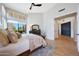 Bright and airy main bedroom features large windows, light wood floors and modern furnishings at 7705 E Doubletree Ranch Rd # 8, Scottsdale, AZ 85258