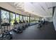 Bright fitness center with modern cardio equipment and expansive windows overlooking green space for an inspiring workout environment at 7705 E Doubletree Ranch Rd # 8, Scottsdale, AZ 85258