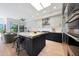 Modern kitchen with stainless steel appliances, granite countertops, and stylish island seating at 7705 E Doubletree Ranch Rd # 8, Scottsdale, AZ 85258