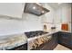 Modern kitchen with stainless steel range, sleek hood, and beautiful countertops at 7705 E Doubletree Ranch Rd # 8, Scottsdale, AZ 85258