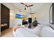 Bright living room featuring a fireplace, light wood floors and a vaulted ceiling with fans at 7705 E Doubletree Ranch Rd # 8, Scottsdale, AZ 85258