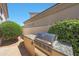 Outdoor stainless steel grill features a granite countertop and lush, green landscaping at 7705 E Doubletree Ranch Rd # 8, Scottsdale, AZ 85258