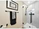 Modern walk-in shower with black hardware, neutral tiling, and glass enclosure at 7705 E Doubletree Ranch Rd # 8, Scottsdale, AZ 85258