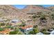 Beautiful desert mountain home offering stunning views with a red tile roof, pool, landscaping, and hillside serenity at 7838 N 54Th Pl, Paradise Valley, AZ 85253