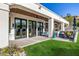 Expansive backyard with a covered patio, outdoor seating, and well-manicured lawn space at 7838 N 54Th Pl, Paradise Valley, AZ 85253