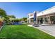 Expansive backyard with a well-manicured lawn, sparkling pool, and patio area for entertaining at 7838 N 54Th Pl, Paradise Valley, AZ 85253