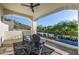 Balcony with comfortable seating and views of the lush landscaping and surrounding hills at 7838 N 54Th Pl, Paradise Valley, AZ 85253