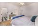 Spacious bedroom with hardwood floors, white walls, and connecting bathroom at 7838 N 54Th Pl, Paradise Valley, AZ 85253