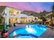 Stately home exterior with a backyard pool, covered patio, and manicured landscaping at 7838 N 54Th Pl, Paradise Valley, AZ 85253