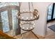 Elegant foyer with a large wrought iron chandelier and beautiful front door at 7838 N 54Th Pl, Paradise Valley, AZ 85253