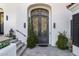 Close up of the decorative iron front door of this home at 7838 N 54Th Pl, Paradise Valley, AZ 85253