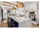 Gourmet kitchen features a large island with seating, stainless steel appliances, and custom cabinetry at 7838 N 54Th Pl, Paradise Valley, AZ 85253