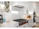 Modern kitchen with stainless steel cooktop, marble backsplash, and sleek cabinetry for a clean look at 7838 N 54Th Pl, Paradise Valley, AZ 85253