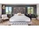 Beautiful main bedroom with elegant decor, large windows, and a comfortable seating area at 7838 N 54Th Pl, Paradise Valley, AZ 85253