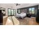 Spacious main bedroom with a fireplace, balcony access, and views of the surrounding landscape at 7838 N 54Th Pl, Paradise Valley, AZ 85253