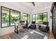 Office with large windows overlooking backyard pool and lush landscaping at 7838 N 54Th Pl, Paradise Valley, AZ 85253