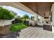 Inviting covered patio with lush garden views and access to outdoor living spaces at 7838 N 54Th Pl, Paradise Valley, AZ 85253
