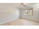 Bright bedroom with large window providing lots of natural light and a ceiling fan at 7970 E Camelback Rd # 110, Scottsdale, AZ 85251