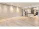 Open living area with light wood floors seamlessly connects to the kitchen at 7970 E Camelback Rd # 110, Scottsdale, AZ 85251