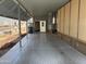 View of long carport showing a door into the main home and storage on the side at 8700 E University Dr # 1450, Mesa, AZ 85207