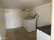 A well lit laundry room includes a full-sized washer/dryer at 8700 E University Dr # 1450, Mesa, AZ 85207