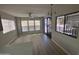 Bright living room with multiple windows, ceiling fan, and sliding glass doors to the outside at 8700 E University Dr # 1450, Mesa, AZ 85207
