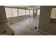 Spacious living room features updated laminate flooring, lots of windows, and ceiling fan at 8700 E University Dr # 1450, Mesa, AZ 85207