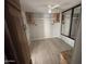 Main bedroom boasts built in vanity, mirror closet, ceiling fan and laminate flooring at 8700 E University Dr # 1450, Mesa, AZ 85207
