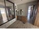 Main bedroom with built in vanity, mirror closet, with laminate flooring at 8700 E University Dr # 1450, Mesa, AZ 85207
