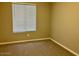 Bedroom featuring neutral colored walls, carpeted flooring, and a window at 8732 W Adam Ave, Peoria, AZ 85382