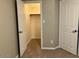 Bedroom with a closet, door and carpeted flooring at 8732 W Adam Ave, Peoria, AZ 85382