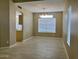 Bright dining room with large window providing natural light and tile floors at 8732 W Adam Ave, Peoria, AZ 85382