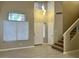 Inviting foyer with high ceilings, abundant natural light, and access to the upper level at 8732 W Adam Ave, Peoria, AZ 85382