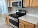 Close up shot of a modern kitchen with quartz countertops, and stainless steel appliances at 8732 W Adam Ave, Peoria, AZ 85382