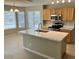 Open kitchen featuring quartz countertops, stainless steel appliances, and ample natural light at 8732 W Adam Ave, Peoria, AZ 85382