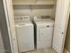 View of laundry area featuring a white, front-load washer and dryer at 8732 W Adam Ave, Peoria, AZ 85382