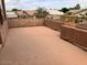 Spacious outdoor patio area with a textured floor and railing at 8732 W Adam Ave, Peoria, AZ 85382
