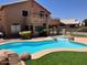 Backyard view featuring a large, private pool and patio area, perfect for outdoor entertaining at 8732 W Adam Ave, Peoria, AZ 85382