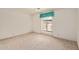 Bright bedroom with a large window at 9123 W Utopia Rd, Peoria, AZ 85382