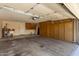 Well-organized garage with storage cabinets and ample parking space at 9123 W Utopia Rd, Peoria, AZ 85382