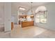Eat-in kitchen with tile floors, an island, white appliances, and lots of light at 9123 W Utopia Rd, Peoria, AZ 85382