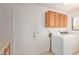 Laundry room featuring a washer, cabinets, and counter space at 9123 W Utopia Rd, Peoria, AZ 85382