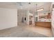 Open floor plan featuring living room, kitchen, and eating space at 9123 W Utopia Rd, Peoria, AZ 85382
