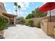 Spacious backyard offers a covered patio, built-in grill and lush desert landscaping at 9460 N 105Th Pl, Scottsdale, AZ 85258