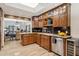 Gourmet kitchen boasts custom wood cabinetry, granite countertops, and stainless steel appliances at 9460 N 105Th Pl, Scottsdale, AZ 85258