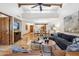 Open-concept living area featuring a fireplace, dining area, and comfortable seating at 9460 N 105Th Pl, Scottsdale, AZ 85258